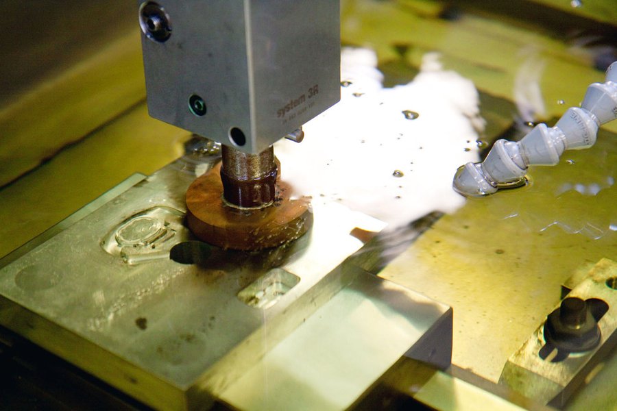 Sinker EDM burning a cavity with a shaped electrode